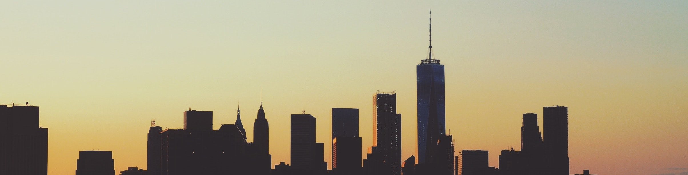 City skyline with orange and light blue sunset. City skyline with orange and light blue sunset.